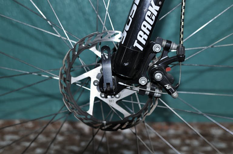 Detailed view of a electric bicycle disc brake system showing the rotor and caliper mechanism.