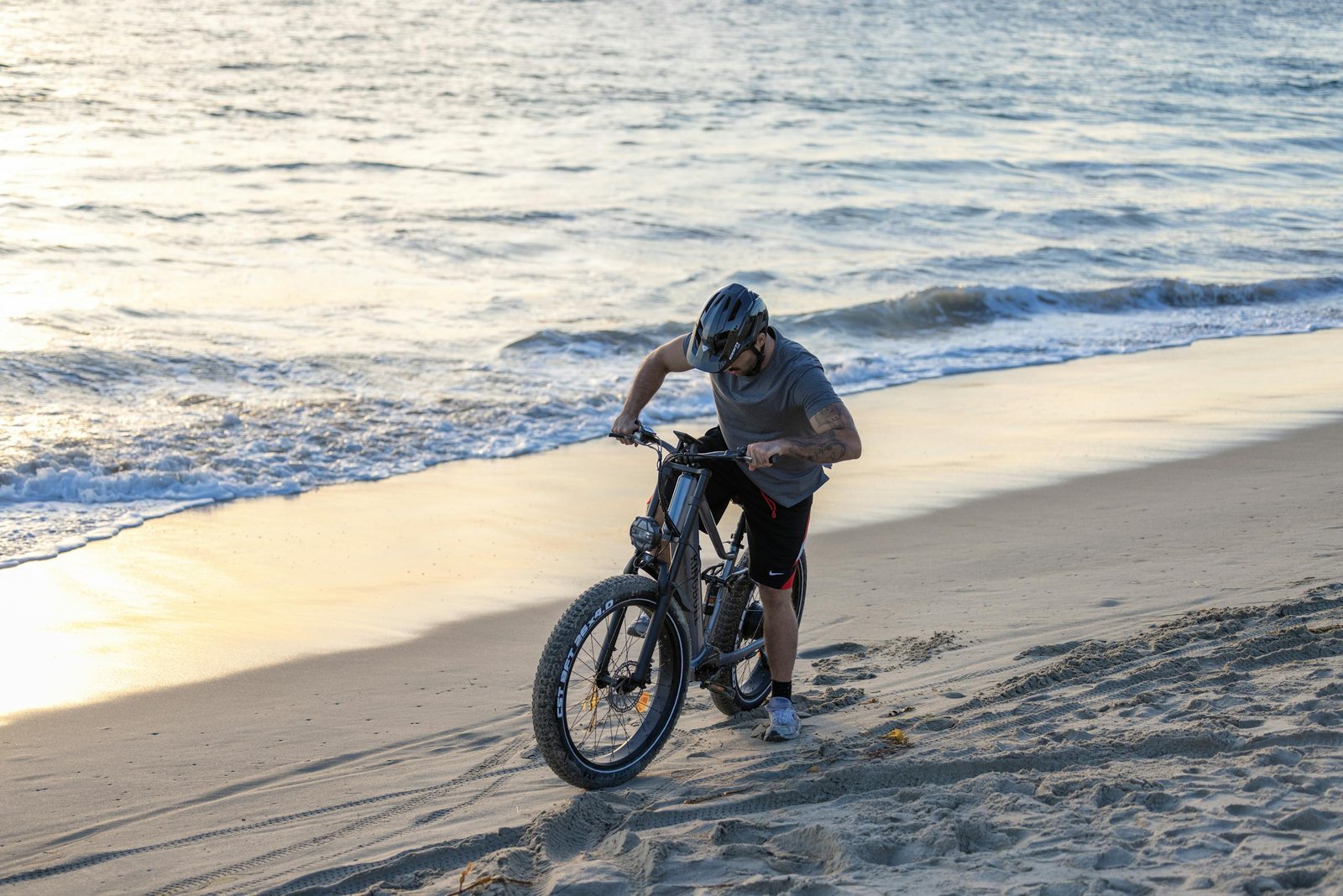 Man on Electric Bike on Beach